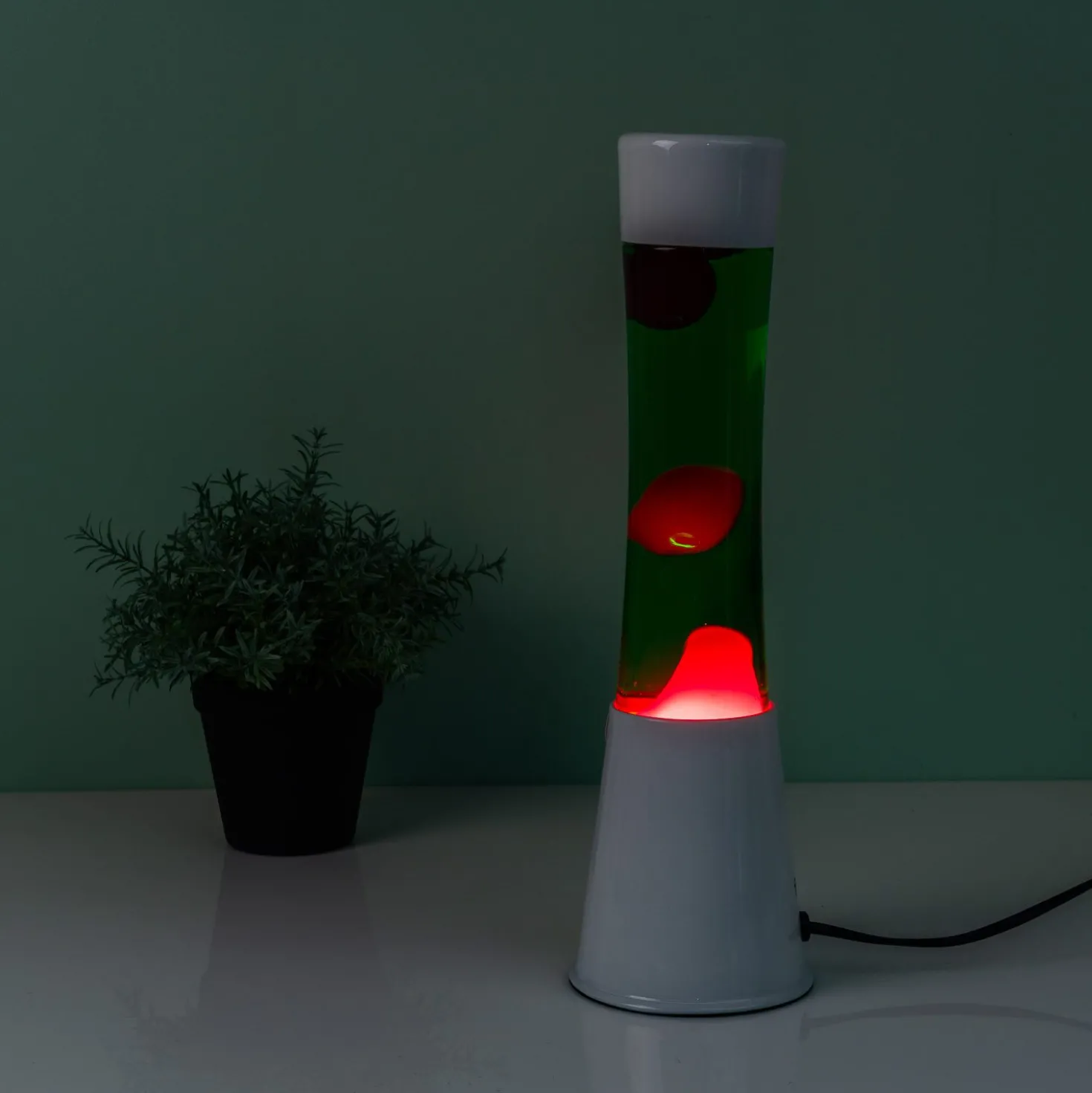 Lavalamp wit met groene vloeistof en roze lava