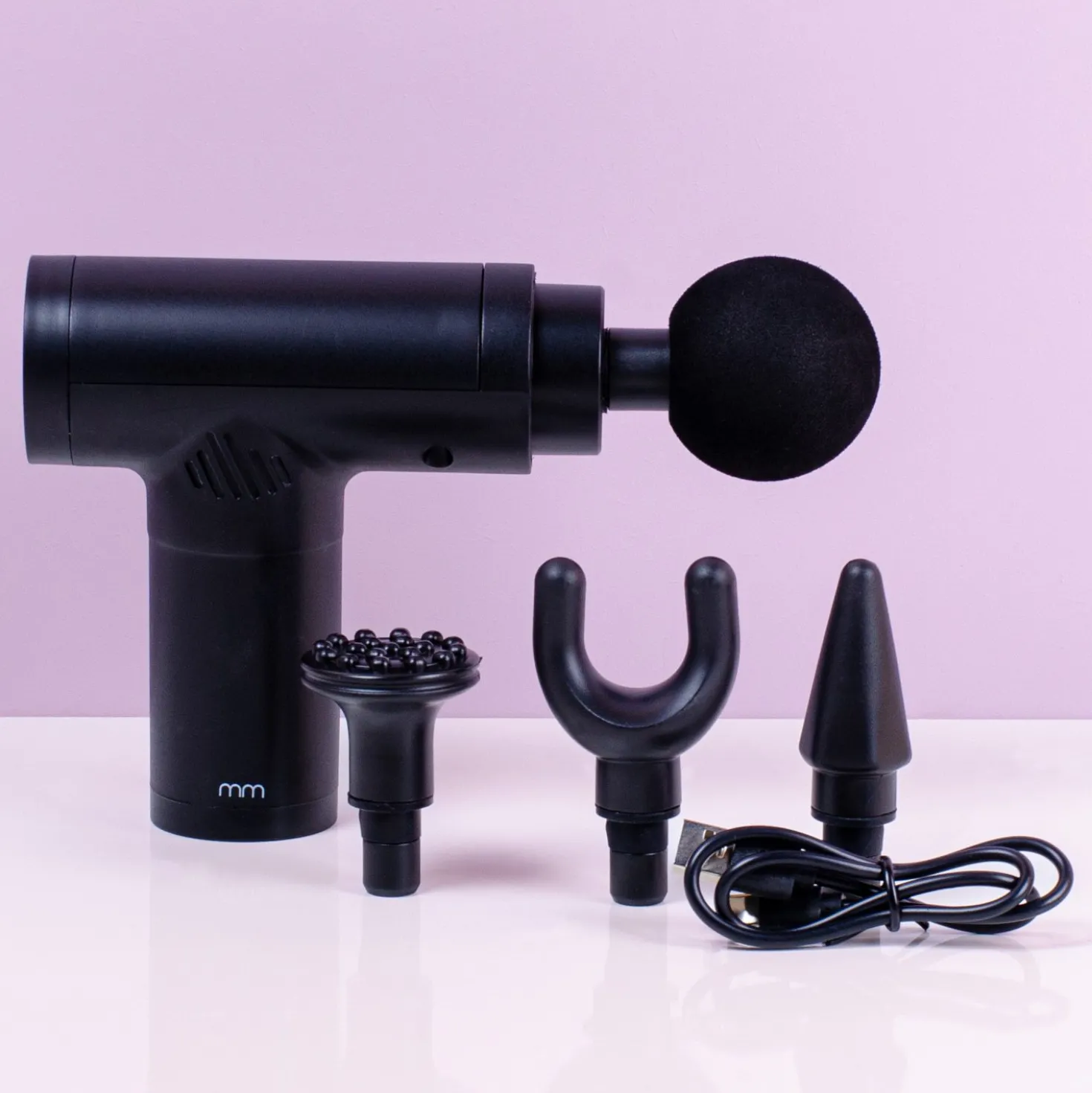Massage gun met opzetstukken