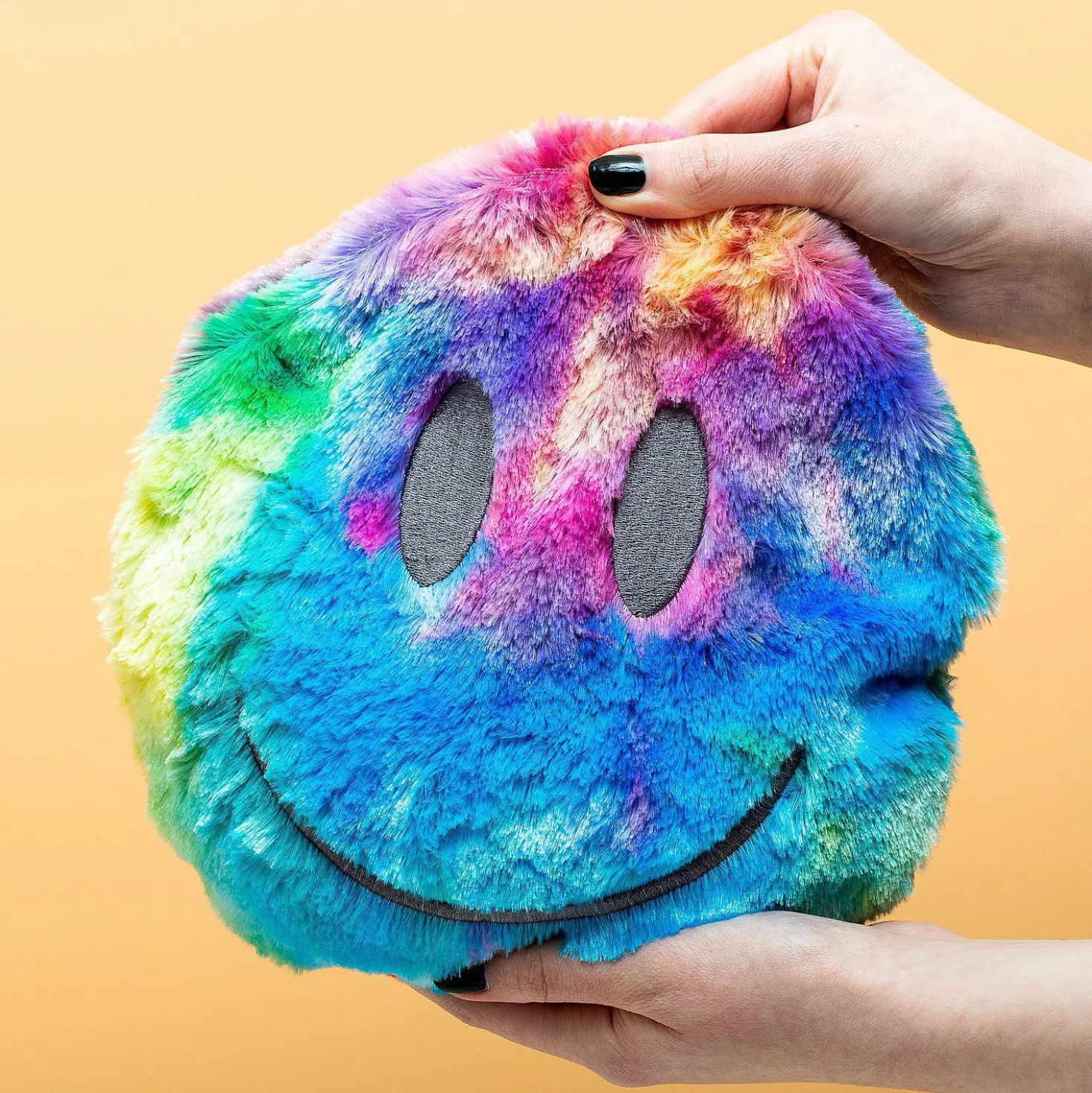 Regenboog smiley warmtekussen