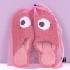 Roze sloffen met ogen